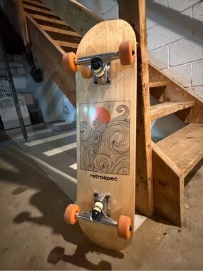 Retrospec Natural Wood Cruiser Skateboard with Orange Wheels and Wave Graphic